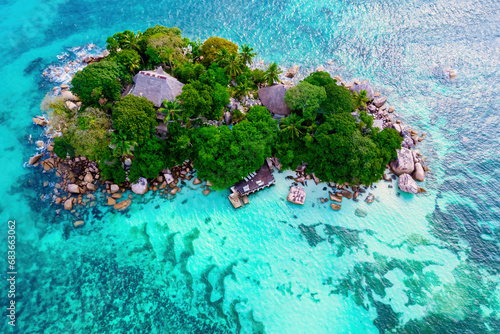 Drone view from above at a tropical Island in Seychelles. Anse Volbert beach Praslin with granite boulders rocks photo