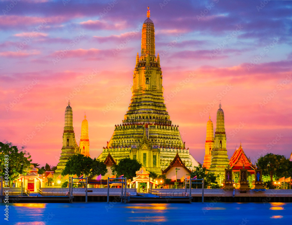 Wat Arun Temple Bangkok Thailand, Temple of Dawn, a Buddhist temple alongside the Chao Phraya River. Beautiful Wat Arun at dusk evening sunset