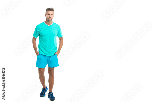 Sport and healthy lifestyle, copy space. full length of athlete. confident athlete wear sport wear standing alone. The male sport athlete in studio. sport athlete with fit body isolated against white © be free
