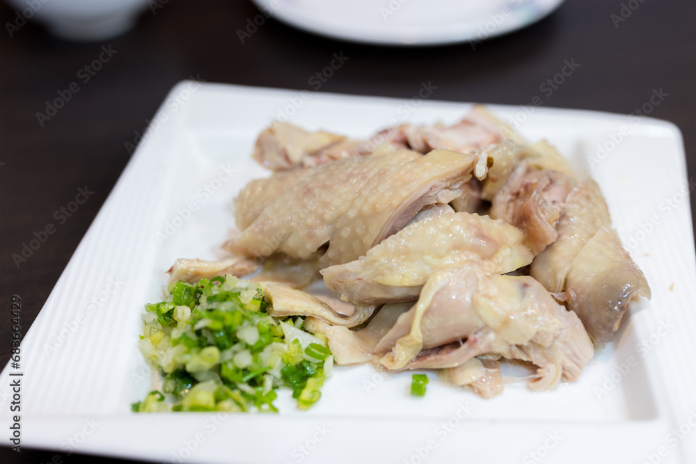 Sliced of steamed chicken in the restaurant Sliced of steamed chicken in the restaurant