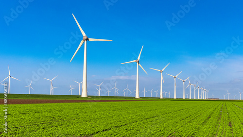 Wallpaper Mural Windmill turbines with blue sky, windmill turbines on land and in the ocean Netherlands Europe  Torontodigital.ca