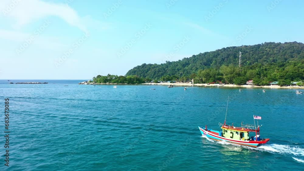 Tourist, boats in the ocean by the coast for a holiday adventure in the Indian sea. Sailing, vacation and riding in Indonesia for summer freedom and coastal fun with transportation for trip Tourist, boats in the ocean by the coast for a holiday adventure in the Indian sea. Sailing, vacation and riding in Indonesia for summer freedom and coastal fun with transportation for trip