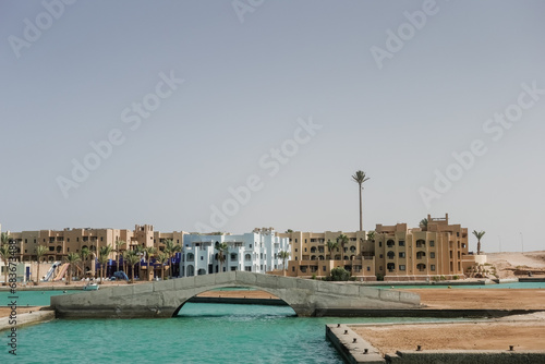 bridge and houses with green water during a trip in port ghalib © thomaseder