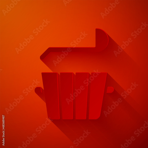 Paper cut Sauna bucket and ladle icon isolated on red background. Paper art style. Vector