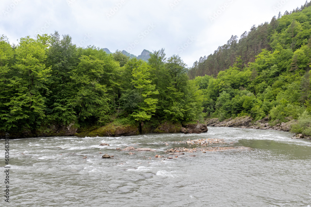 river, mountainous terrain, cloudy day, the beginning of the summer period, walking in the bosom of nature, panorama of the area. river, mountainous terrain, cloudy day, the beginning of the summer period, walking in the bosom of nature, panorama of the area.