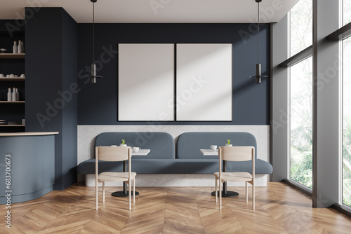 Gray restaurant interior with sofas and poster © ImageFlow