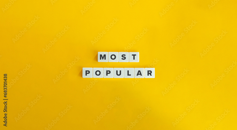 Most Popular Phrase on Alphabet Letter Blocks on Yellow Background. Minimal Aesthetic. Most Popular Phrase on Alphabet Letter Blocks on Yellow Background. Minimal Aesthetic.