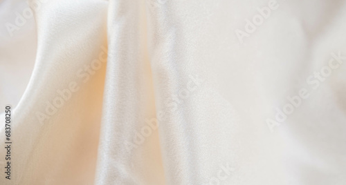 Abstract background of luxury fabric, folded textile or liquid wave or wavy folds silk texture satin material