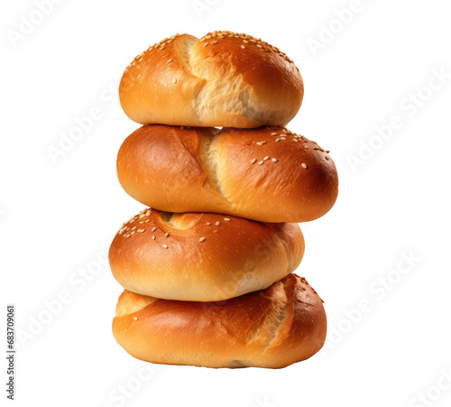 bunch of breads with white breads piled on top