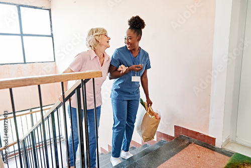 Картината върху платно nurse senior woman home care patient elderly caregiver walking step staircase re
