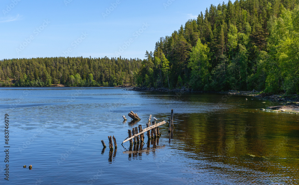 The remains of the old pier on the island of Valaam on Lake Ladoga The remains of the old pier on the island of Valaam on Lake Ladoga