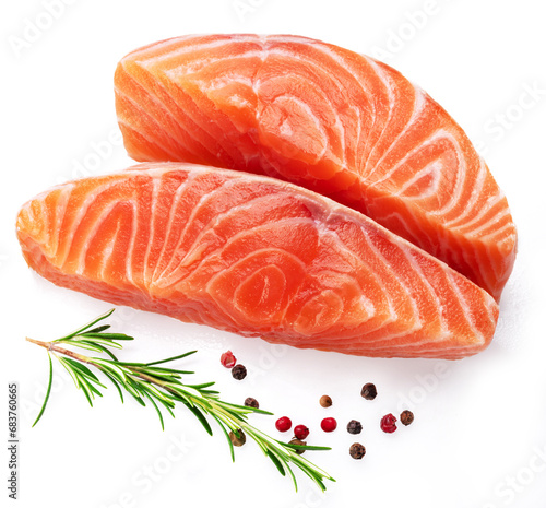 Salmon, fresh salmon fillet slices with herbs isolated on white background.