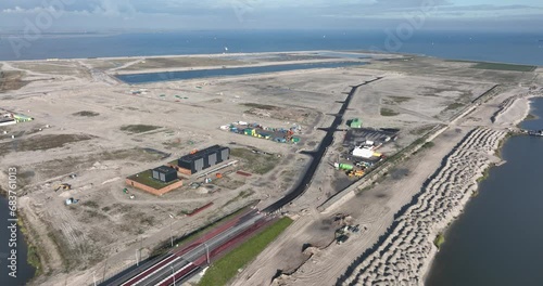 Artifical island for residential purpose, Middeneiland, Buiteneiland and Strandeiland in Amsterdam, The Netherlands. Aerial drone view. Under construction. photo
