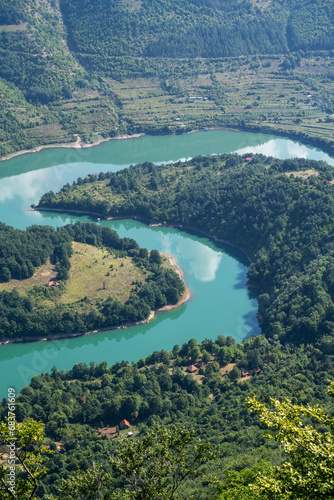 The Kozji Kamen viewpoint offers a beautiful view of Lake Zavojsko, the meanders of the Visocica River and mountain peaks. Serbia near Pirot.