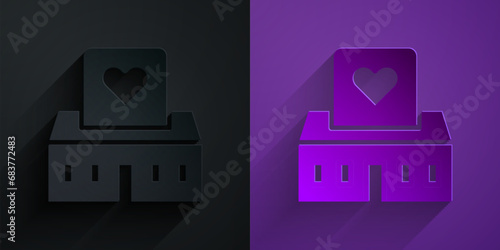 Paper cut Volunteer center icon isolated on black on purple background. Paper art style. Vector