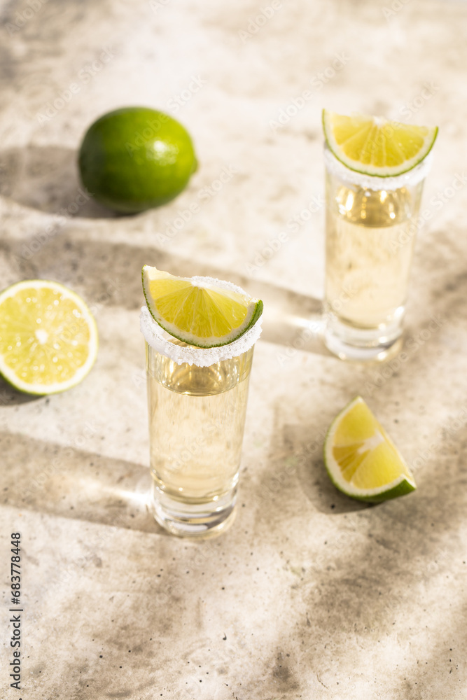 Shot of tequila, salt, lime, alcoholic drink Shot of tequila, salt, lime, alcoholic drink