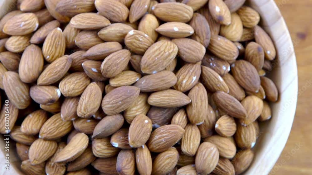 Almond kernel in a bowl. Background view from above. Healthy food Almond kernel in a bowl. Background view from above. Healthy food