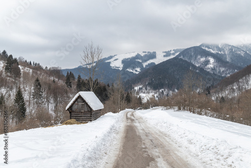 Road in a winter landscape with snowy mountains. Liptov region in Slovakia, Europe. © Viliam