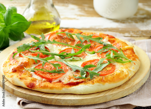 fresh delicious pizza with tomatoes and basil