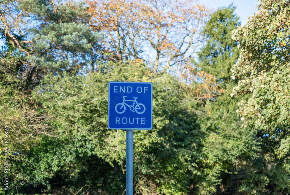 Close and selective focus on an end of cycle route sign in the countryside