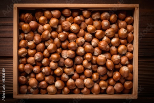 Top view of hazelnuts in a wooden box