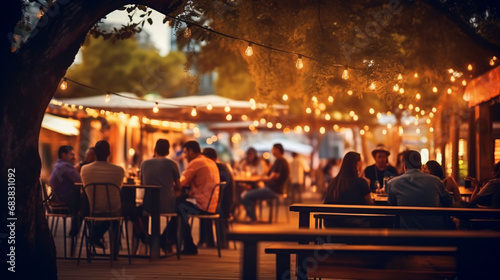a group of people  defocused  at a summer outdoor restaurant and bar  sunny warm lights and soft bokeh  during golden hour