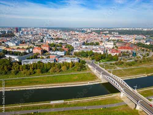 Aerial landscape of Warta river, Saint Roch's bridge and distant Old Market, Poznan