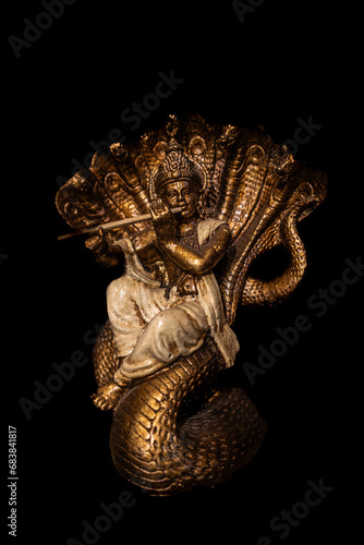 Krishna statue with black background