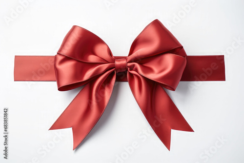 Bright red colored ribbon tied in a bow on white background. 