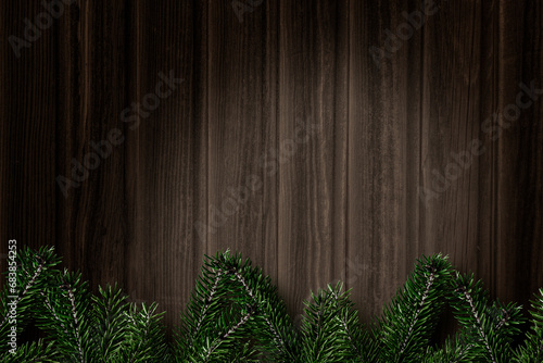 Weihnachtshintergrund aus Holz und mit Tannenzweigen als Weihnachtsdekoration