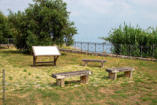 Stone benches and an ancient plaque on the territory of the amphitheater