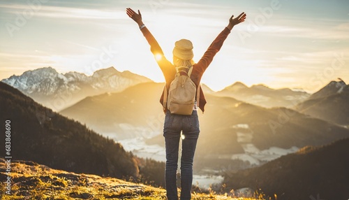 Success story: A woman on top of the mountain with arms open to a welcoming new day with sunrise success. Generative Ai