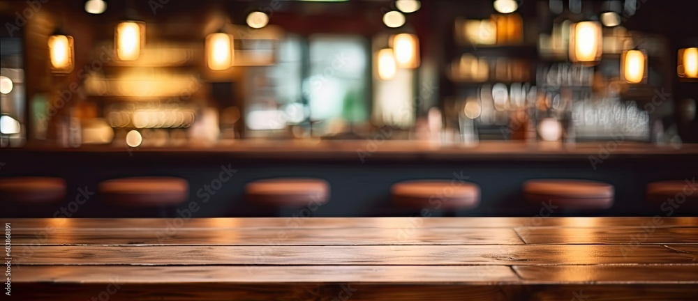 Vintage elegance. Blurred wooden table in dimly lit cafe ideal for creating retro atmosphere and showcasing products or ambiance