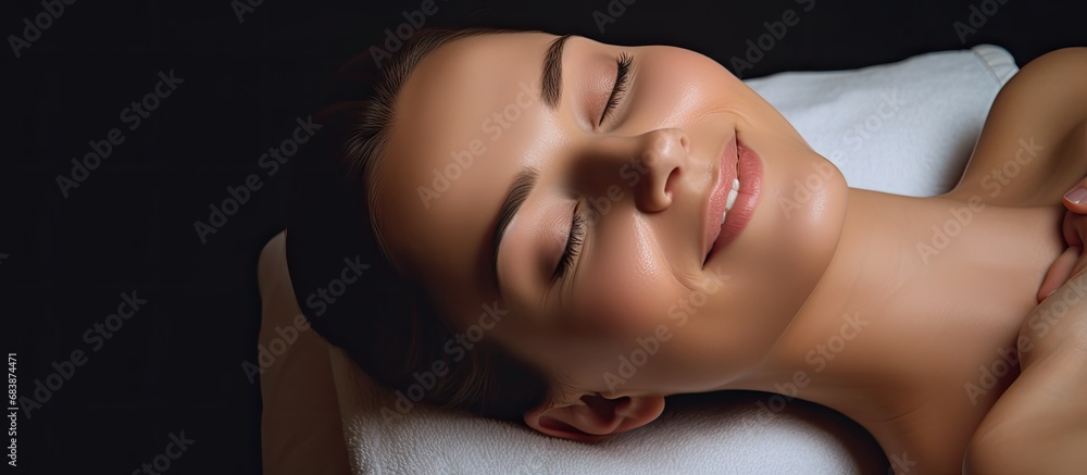The young and beautiful woman smiled radiantly as the expert beautician s skilled hands worked their magic during the luxurious spa massage, perfectly blending the concept of health, beauty, and The young and beautiful woman smiled radiantly as the expert beautician s skilled hands worked their magic during the luxurious spa massage, perfectly blending the concept of health, beauty, and