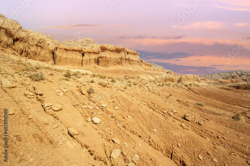 Experience the breathtaking beauty of the Red Boguty Mountains. Witness the mesmerizing dance of colors as sand and sky collide. Plunge into a world of peace and serenity.