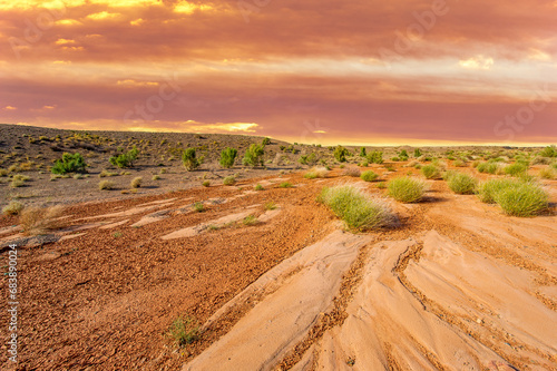 Enjoy a breathtaking sunset in the desert. Witness the vibrant colors of the Boguty Mountains at dusk. Immerse yourself in a kaleidoscope of colors at sunset.