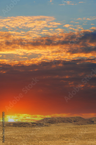 Steppe, prairie, plain, pampa. When the sun bids farewell to the prairie, its radiant colors paint the sky in an awe-inspiring masterpiece. Nature Unleashed, Golden Farewell