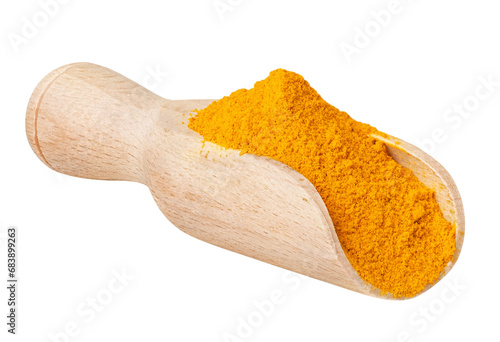 Curcuma or curcumin isolated on white or transparent background. Dry ground turmeric powder in wood spoon