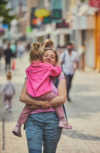 Mom and daughter walk around the city in the Netherlands