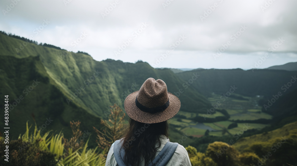 Woman in Hat Gazing at Green Mountain Valley Landscape Adventure Travel 