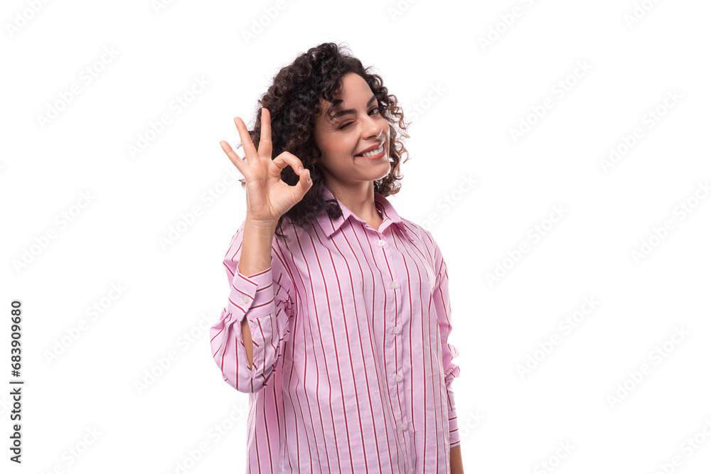 young european curly brunette woman uses gesticulation young european curly brunette woman uses gesticulation