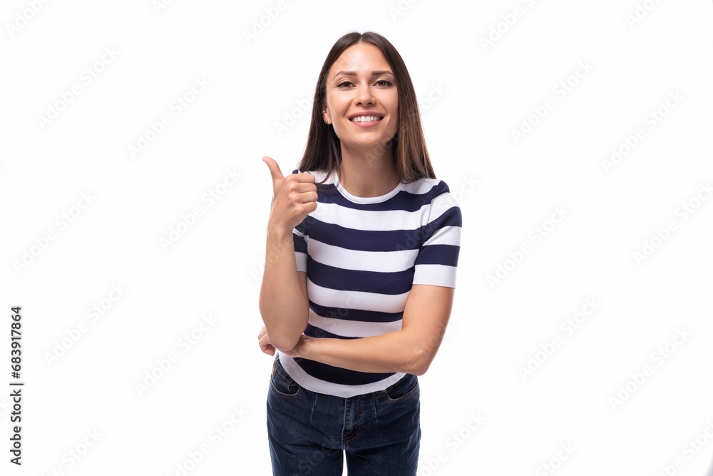 young lucky happy brunette woman with straight hair dressed in a striped t-shirt young lucky happy brunette woman with straight hair dressed in a striped t-shirt