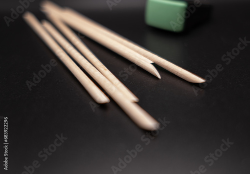 Magnet for manicure and wooden sticks for manicure and cuticles