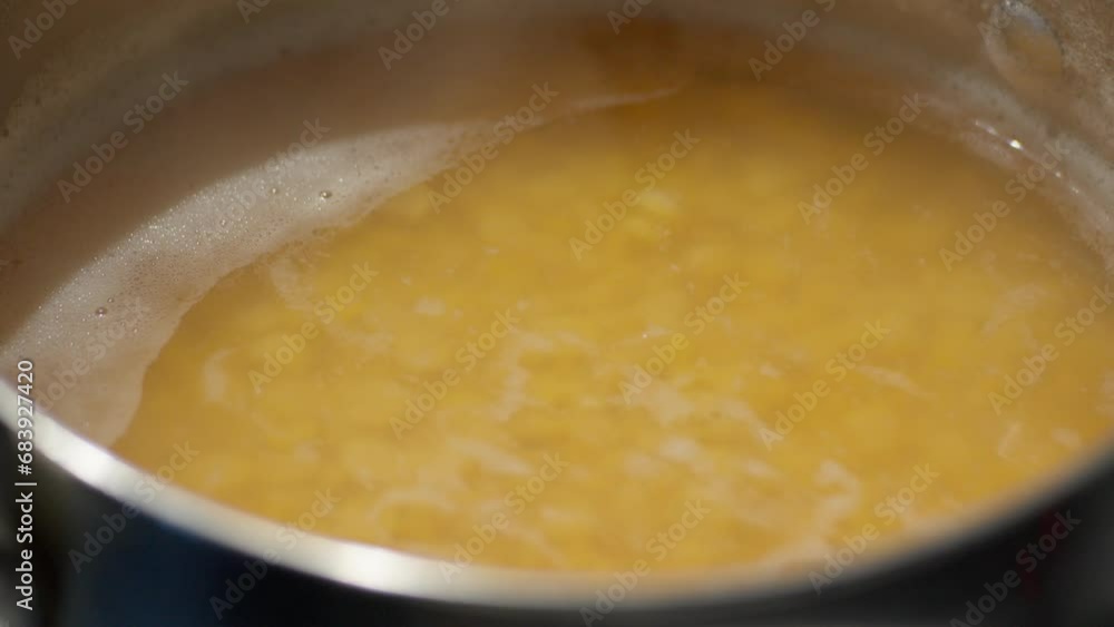 Cooking peas in a saucepan close-up. Homemade Veggie food Cooking peas in a saucepan close-up. Homemade Veggie food