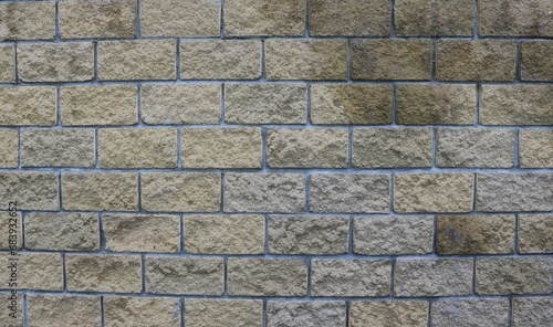 graphic resource of brickwork in brown and gray tones, with an uneven textured surface of lines and rectangles, brick backdrop with empty space for insertion