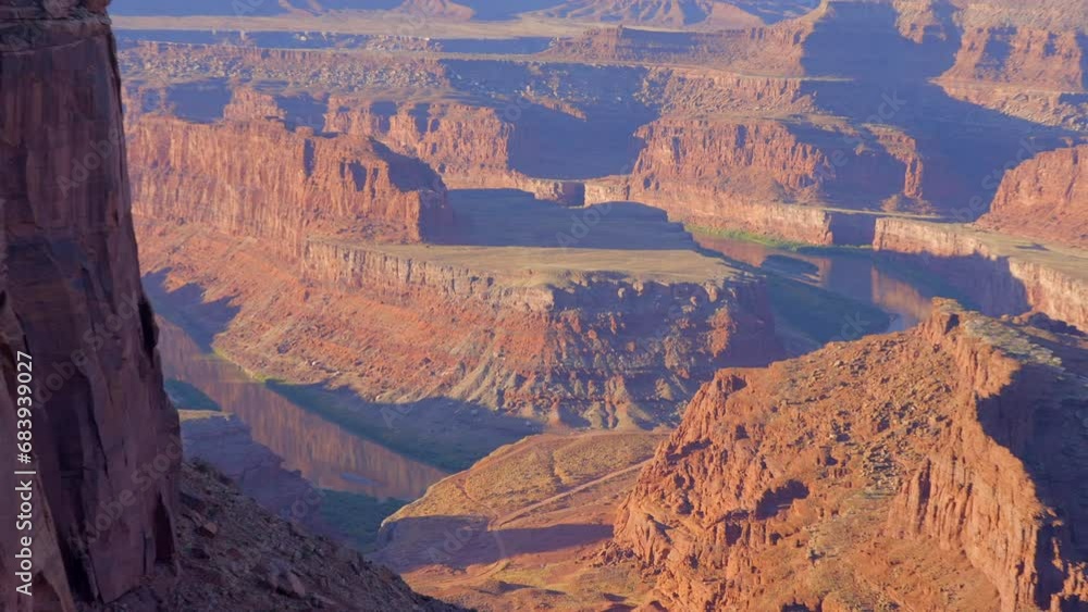Establishing shot of mountains with red rocks in Overlook Dead Horse Point, Capital Reef National Park, Utah, North America. Day time on October 2023. Still camera view. ProRes 422 HQ. Establishing shot of mountains with red rocks in Overlook Dead Horse Point, Capital Reef National Park, Utah, North America. Day time on October 2023. Still camera view. ProRes 422 HQ.