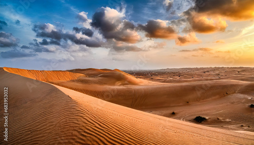 Sand dunes at sunset in the Wahiba Sands desert with clouds in the sky, Oman, Middle East photo