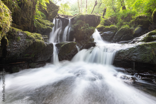 Long exposure of a waterfall on the Hoar Oak Water river at Watersmeet in Exmoor National Park