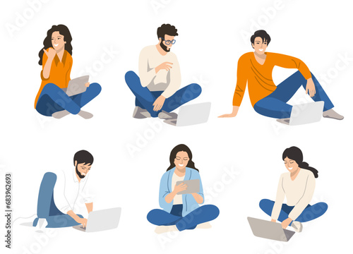 Group   students is sitting on the grass with a laptop. Education concept