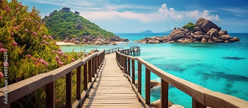 Wooden bridge at beautiful clear water island landscape. AI generated image